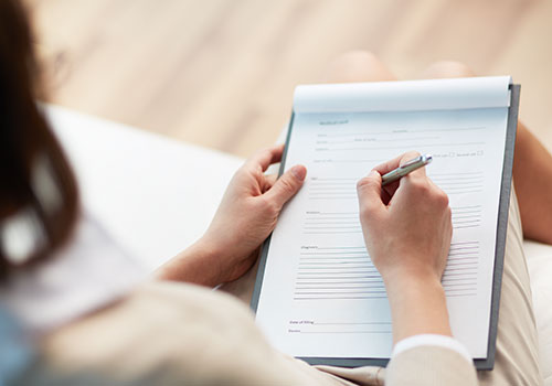 Woman filling out paperwork
